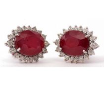 Pair of modern large ruby and diamond cluster earrings, the oval faceted ruby 12 x 10mm, raised