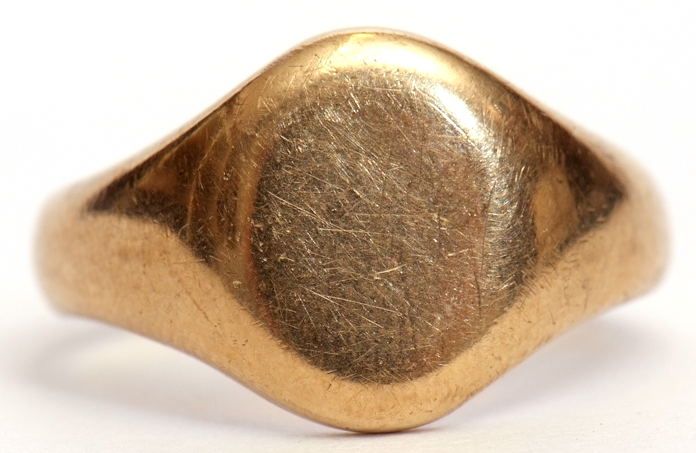 9ct gold gent's signet ring a plain polished oval shaped panel and shoulders, hallmarked