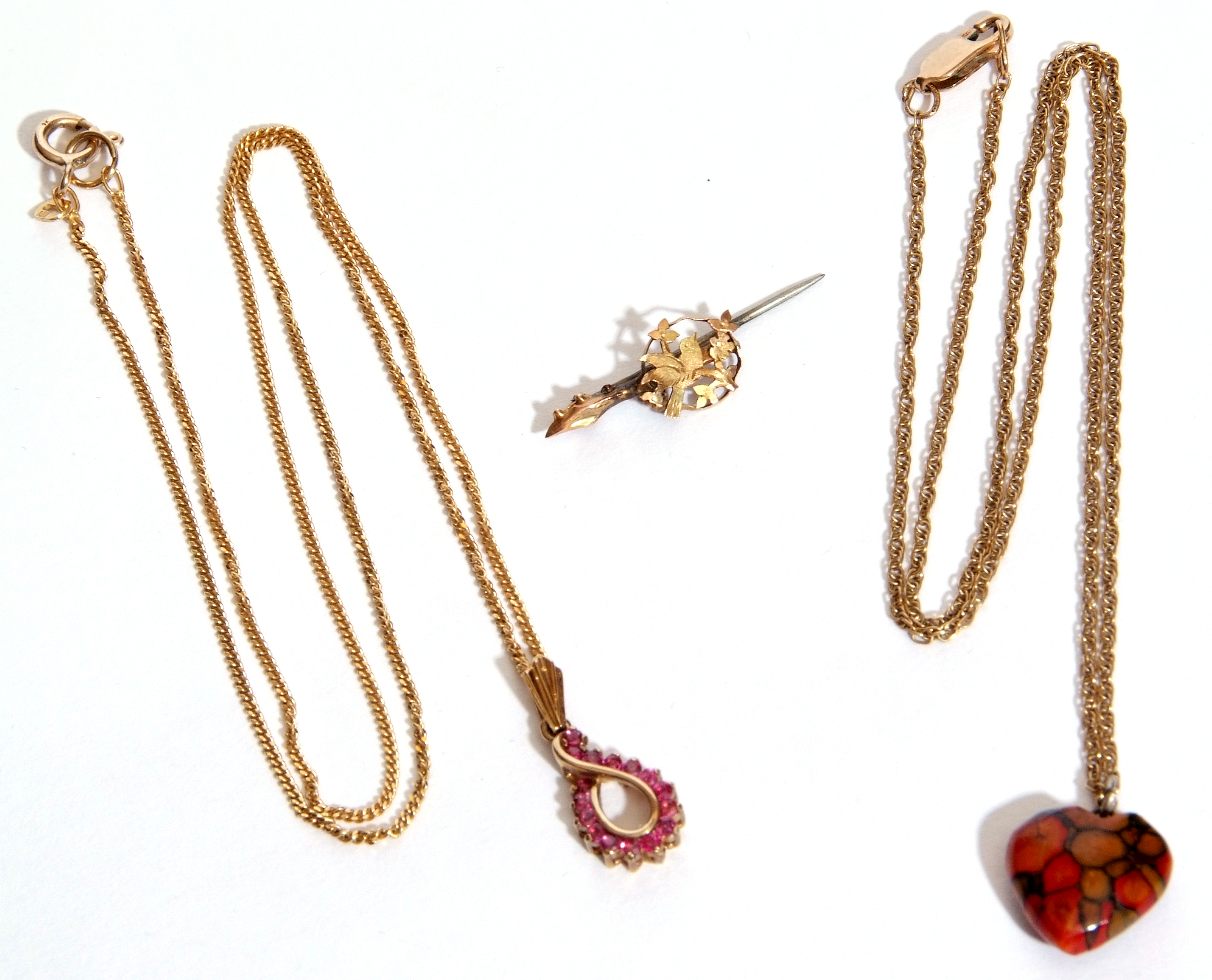 Mixed Lot: modern 9ct gold and ruby pendant on a 9kt stamped trace chain, a 9ct gold trace chain - Image 2 of 3