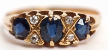 Early 20th century 18ct gold blue stone and diamond ring, the three graduated stones interspersed by