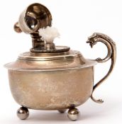 Edward VII silver table lighter of cup form supported on three ball feet, having a hinged domed