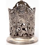 Early 20th century French white metal bottle stand of cylindrical form, well pierced and engraved