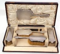 Cased Britannia standard back six-piece dressing table set comprising a hand mirror, two hair