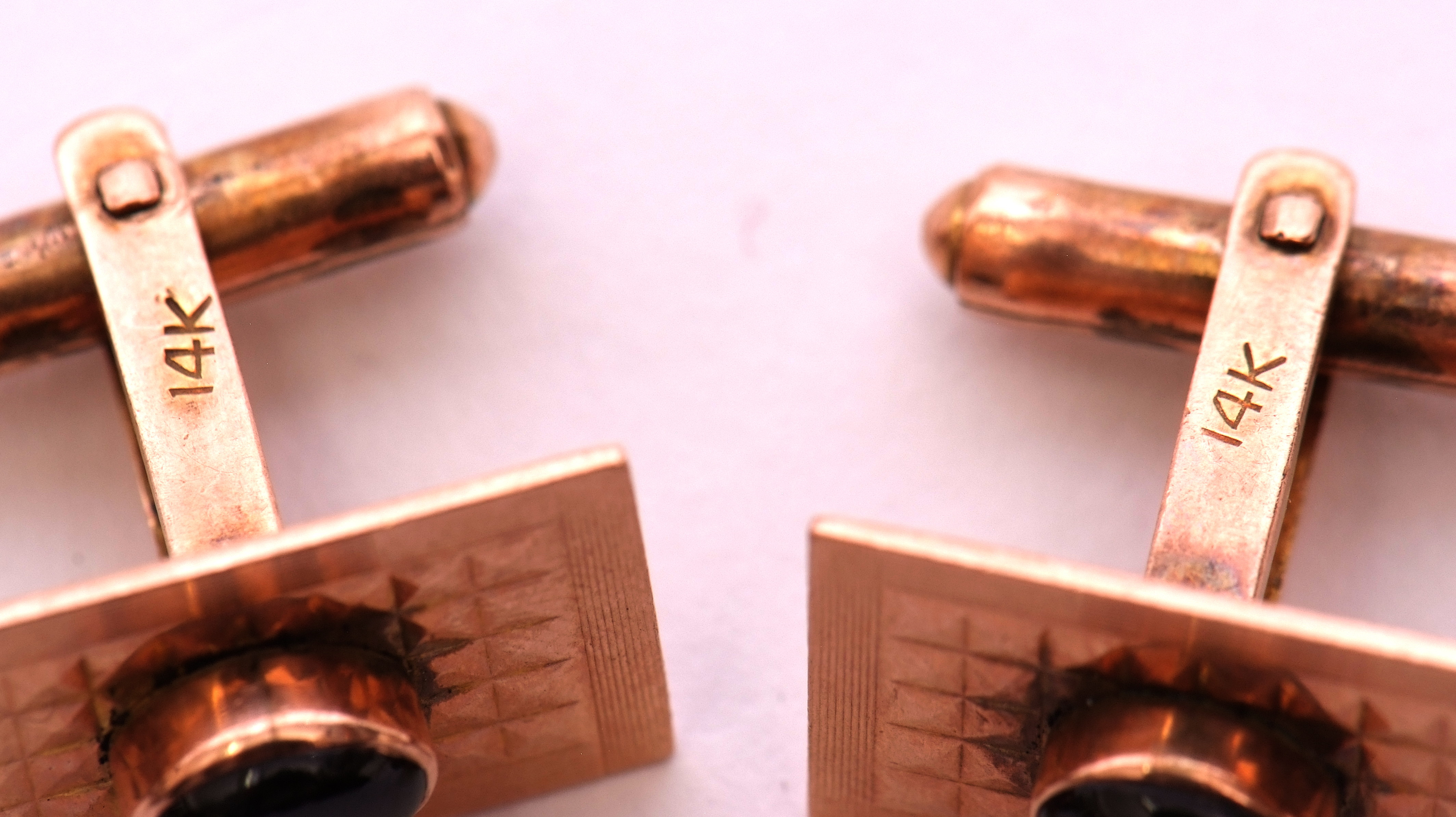 Pair of 14k stamped stylised cuff links each centring an oval cabochon tiger's eye stone, raised - Image 3 of 3