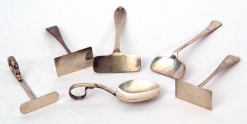 Mixed Lot: five various 20th century child's food pushers and a feeding spoon, 96gms total (6)