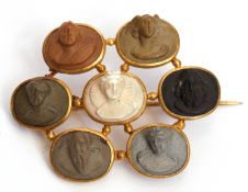 Victorian lava cameo brooch featuring seven classical figures carved in high relief and individually