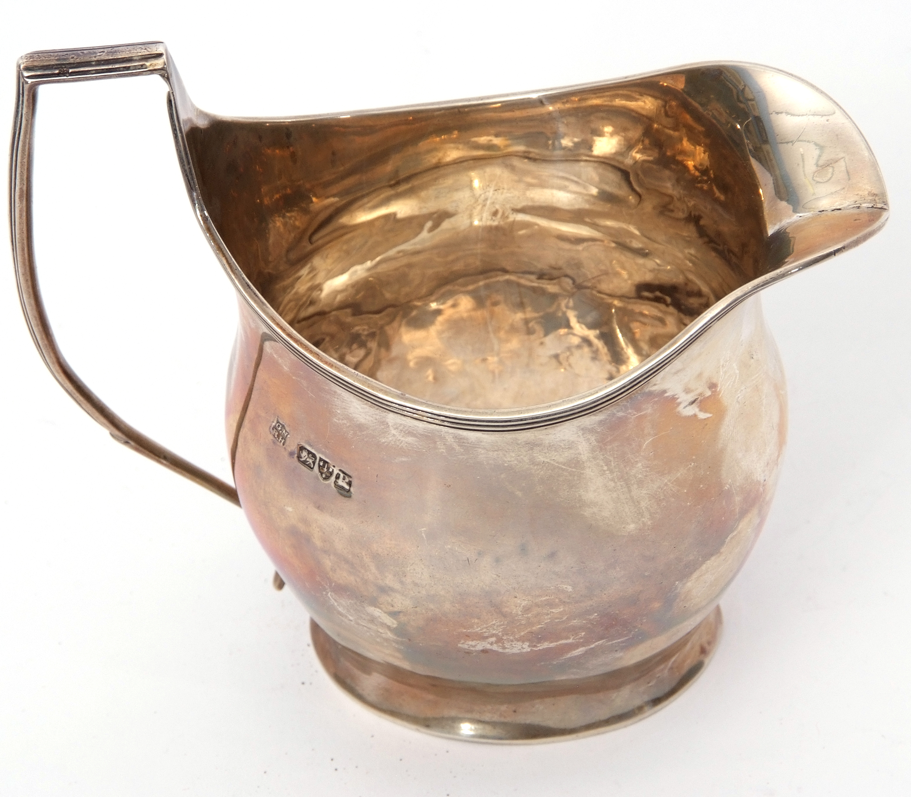 Late Victorian helmet cream jug in George III style, having reeded rim and angular handle, Chester