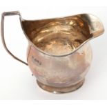 Late Victorian helmet cream jug in George III style, having reeded rim and angular handle, Chester