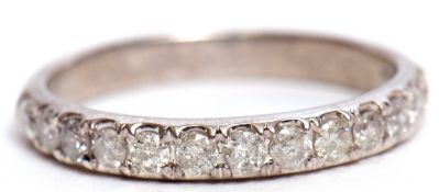 Modern precious metal diamond half eternity ring, featuring 13 single cut diamonds, stamped 10K,