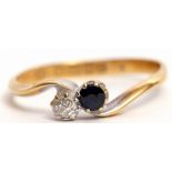 Early 20th century 18ct gold sapphire and diamond cross over ring, set with a circular cut