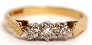 Three stone diamond ring, the small graduated single cut diamonds in illusion settings raised