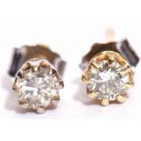 Pair of diamond stud earrings, the brilliant cut diamonds raised in coronet settings, having post