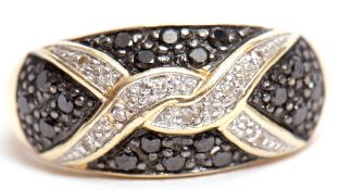 Modern black and white diamond ring, a design of overlapping white diamonds interspersed with