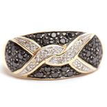 Modern black and white diamond ring, a design of overlapping white diamonds interspersed with