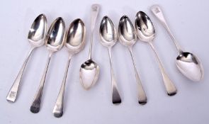 Group of seven Georgian dessert spoons in Old English pattern and a later example, 268gms total (8)