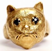 Antique yellow gold cat ring, the naturalistic cat's textured profile set with two small circular