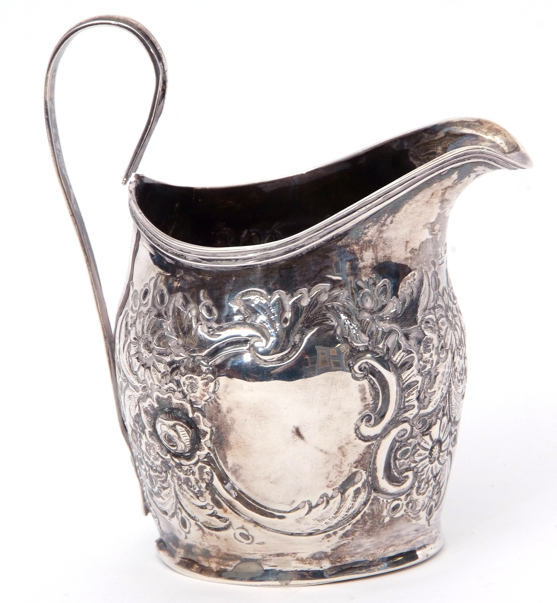 George III helmet cream jug, later embossed with floral and foliate design, reeded looped handle, - Image 2 of 2