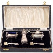 Cased three piece condiment set, a pepper, open salt with blue glass liner, a hinged lidded