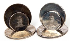 Pair of Edward VII disc formed menu holders, each bearing a dragon's head crest, Chester 1905 by