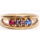 Yellow metal dress ring, the split polished shank set with 4 small precious gemstones, size P (