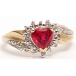 Modern 9ct gold diamond and red stone ring, the heart shaped red stone within a surround of small