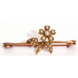 Vintage yellow metal and seed pearl brooch, flower and leaf design, set throughout with graduated