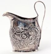 George III helmet cream jug, later embossed with floral and foliate design, reeded looped handle,