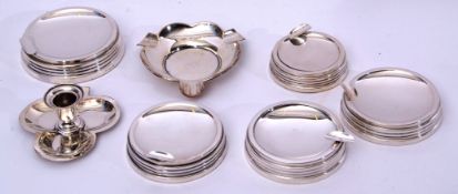Mixed Lot: set of five Elizabeth II silver encased ash trays of circular form with reeded sides