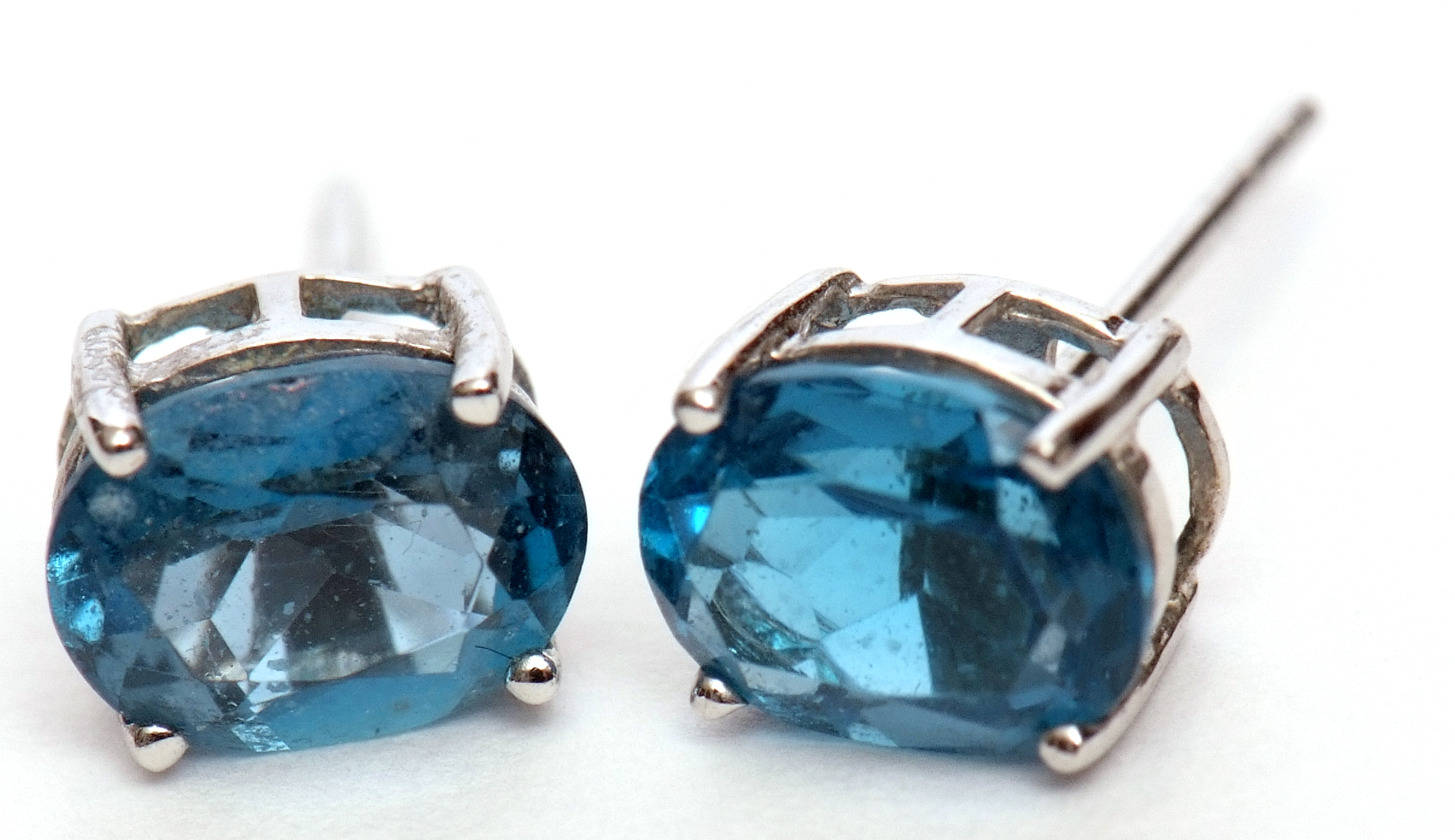 Pair of "London" blue topaz earrings, oval faceted shape, claw set in 9k stamped white mounts, - Image 2 of 4