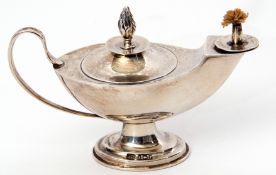 George V table lighter in the form of an Aladdin's lamp with scrolled handle, loaded circular