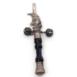 Late 20th century white metal mounted and ebonised wood handle whistle/rattle/teether in the form of