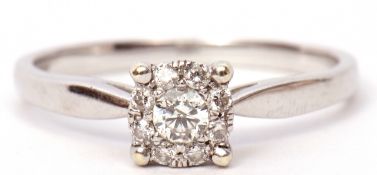 Modern 9ct white gold and diamond cluster ring, the principal brilliant cut diamond is 0.15ct approx