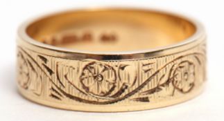 9ct gold wedding band engraved and chased with floral and foliate design, 3.6gms, size L/M