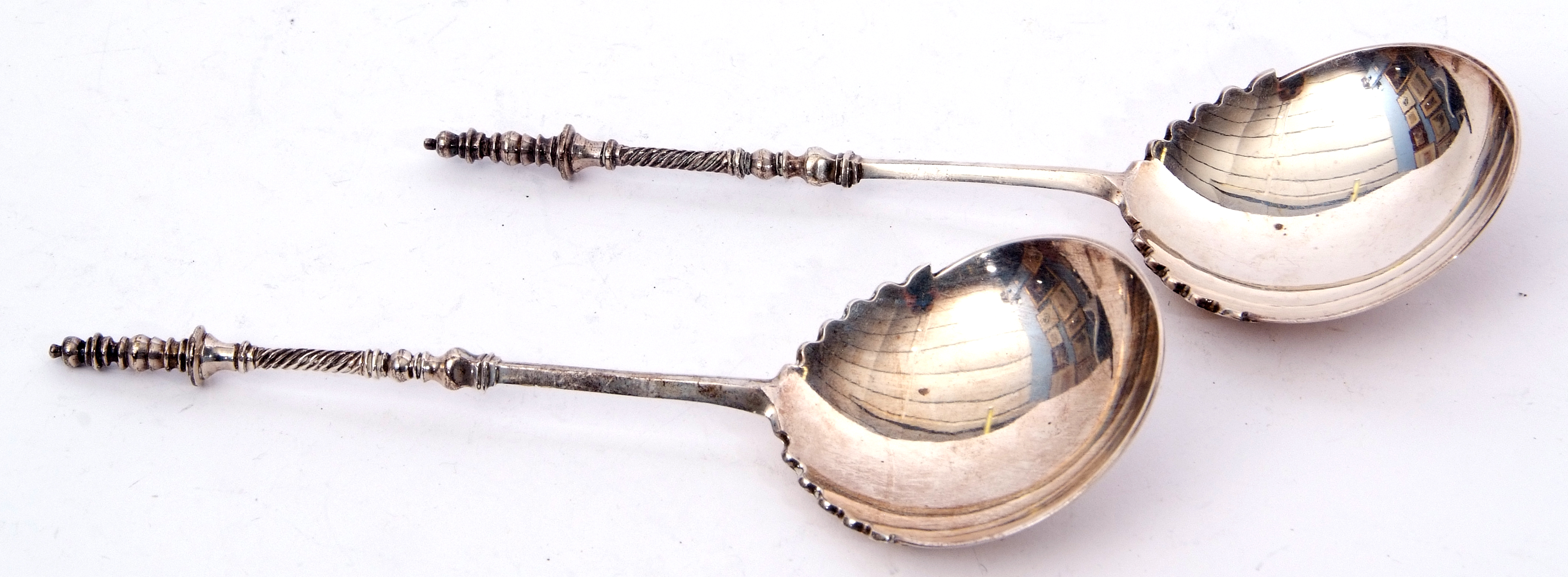 Pair of late Victorian serving spoons with unusual serrated edges to bowls, barley twist and