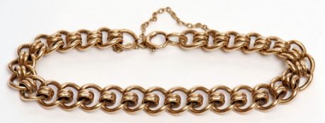 9ct gold curb and coil link bracelet, safety chain fitting, hallmarked Birmingham 1982, 27.8gms