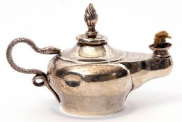 Edwardian table lighter in the form of an Aladdin oil lamp, having naturalistically engraved serpent