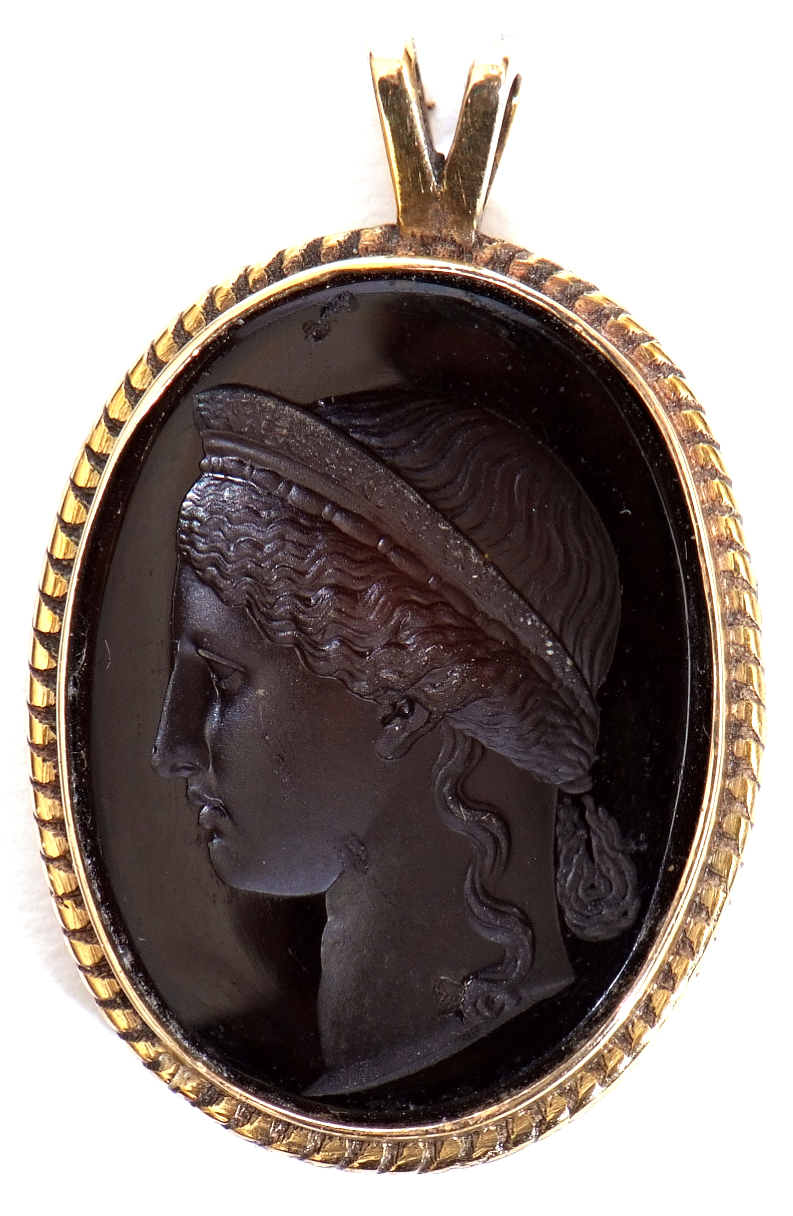 Glass intaglio pendant of oval form depicting a classical figure in a plain polished and rope