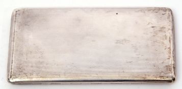 George VI cigarette case of engine turned rectangular form with chamfered edges, with slide to