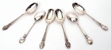 Set of six George V heavy tea spoons, the handles embossed with flowers and historic military
