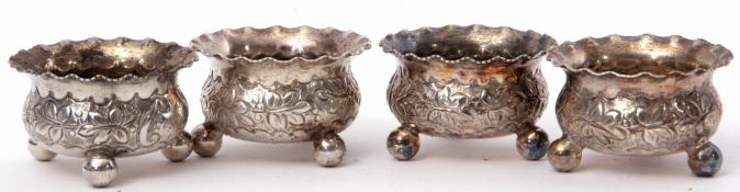 Set of four Victorian cauldron salts with crimped rims, foliate engraved bodies and each supported