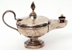 George V table lighter in the form of an Aladdin oil lamp with serpent handles and flambeau finials,