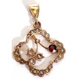 9ct stamped open work pendant set with a small garnet and highlighted with seed pearls throughout