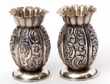 Pair of late Victorian miniature baluster vases with foliate embossed baluster body, wavy top and