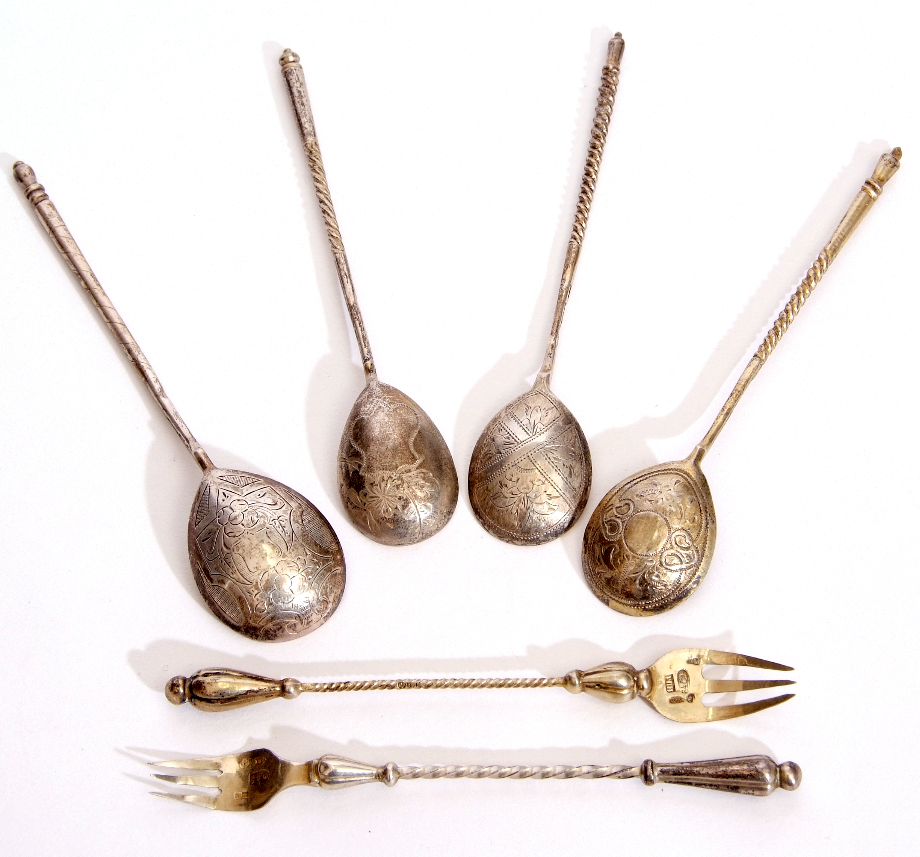 Group of 19th century Russian small silver gilt flatware items including four spoons with egg shaped