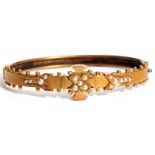 Edwardian gold and seed pearl hinged bracelet, the centre a Maltese cross design set with small seed