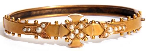 Edwardian gold and seed pearl hinged bracelet, the centre a Maltese cross design set with small seed