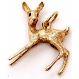 9ct gold pendant/charm of a naturalistic design of a deer with chased detail, 4.6gms