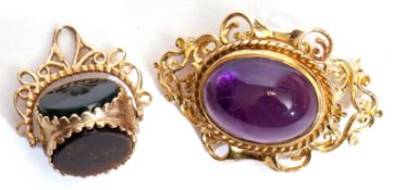 Mixed Lot: 9ct gold and amethyst brooch, a large oval amethyst cabochon in an ornate rope and scroll