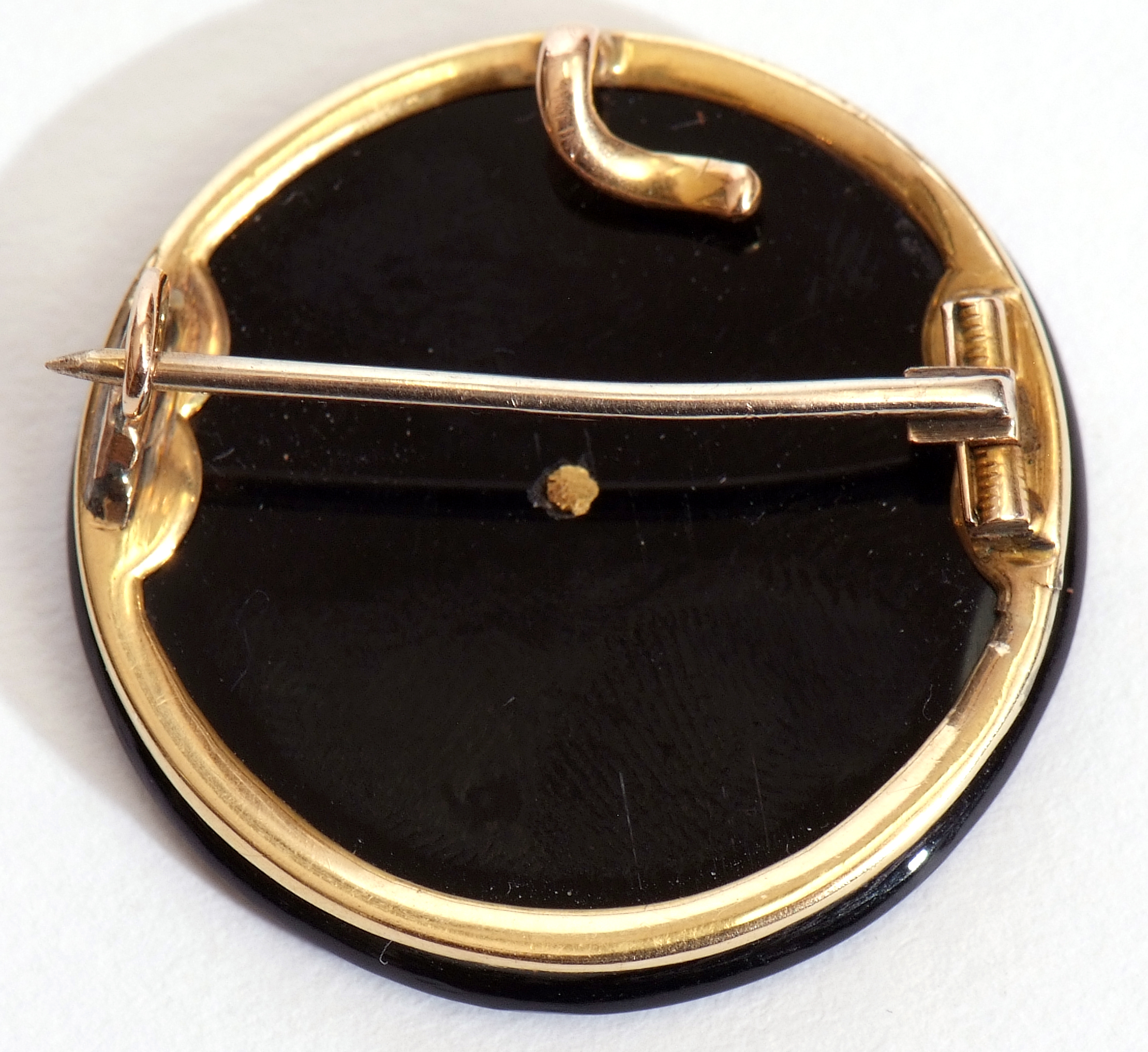 Antique diamond and onyx brooch, the circular polished onyx face set with an old cut diamond in a - Image 2 of 2