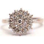 Diamond cluster ring, the three tiers of brilliant cut diamonds all in a basket mount, stamped 18ct,